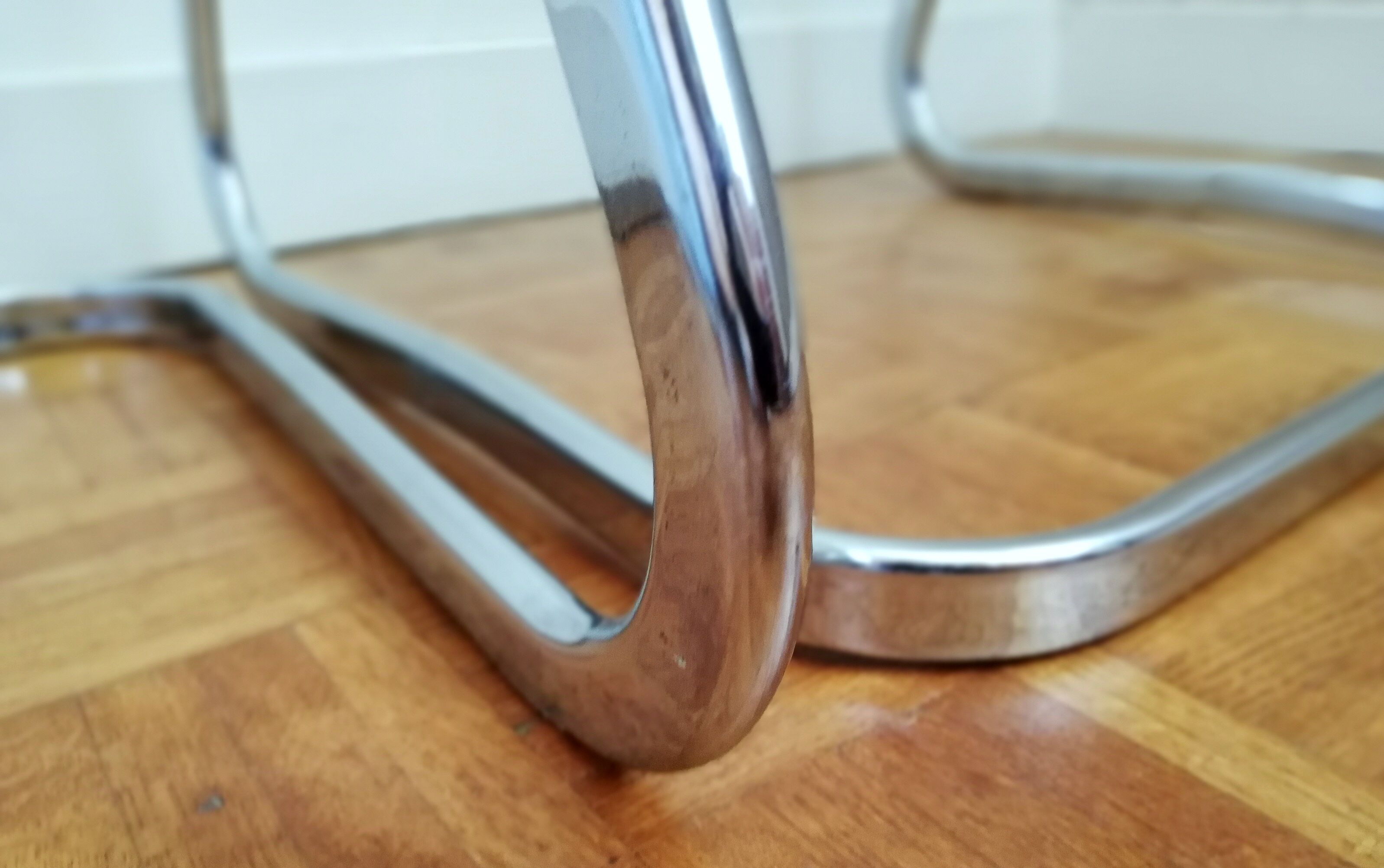 2 chrome wired chairs