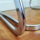 2 chrome wired chairs