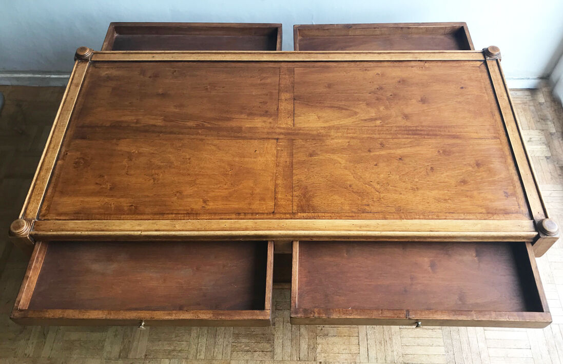 A solid wood-marked coffee table.