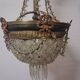 Antique balloon chandelier with pendants, in brass and with mouldings.
