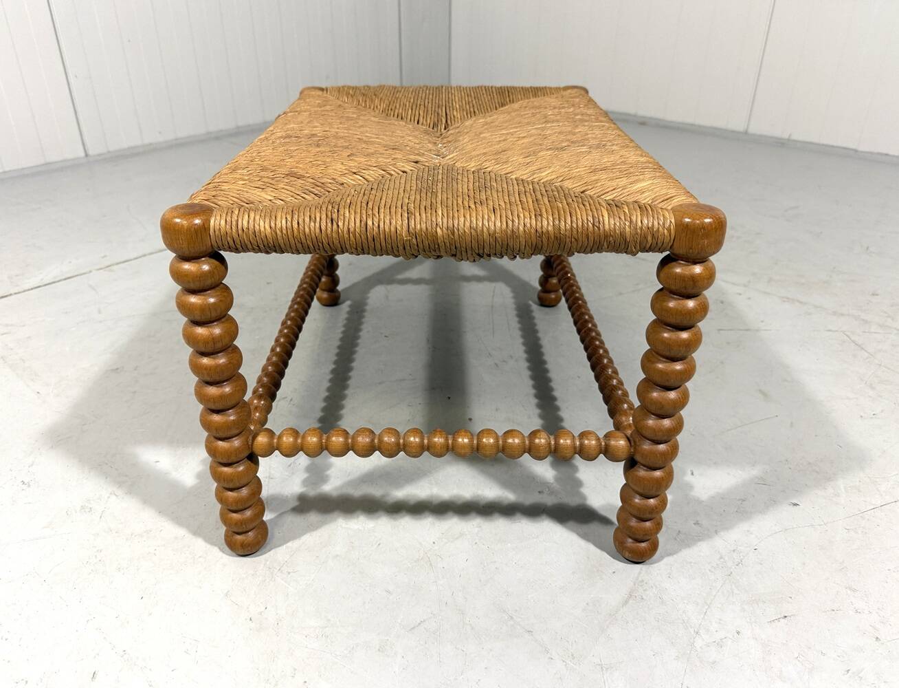 Low oak bobbin stool with rush seat 1930’s