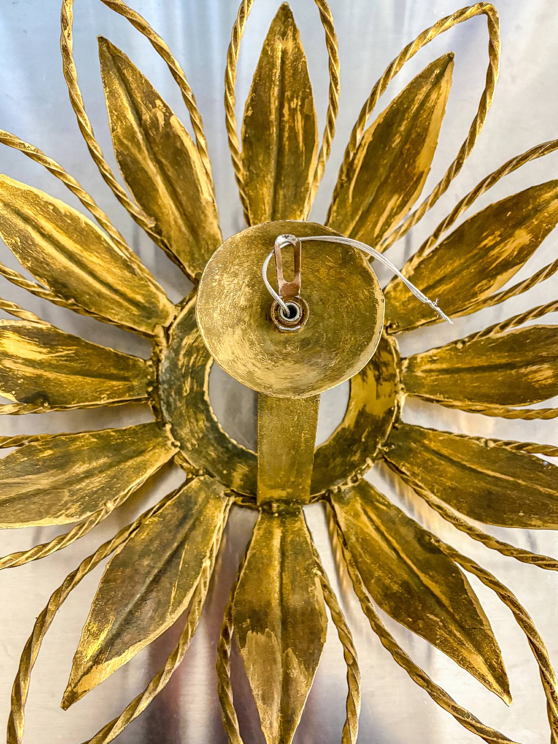 Sunburst ceiling light fixture or sconce, gilt iron & exposed bulb France, 1970s