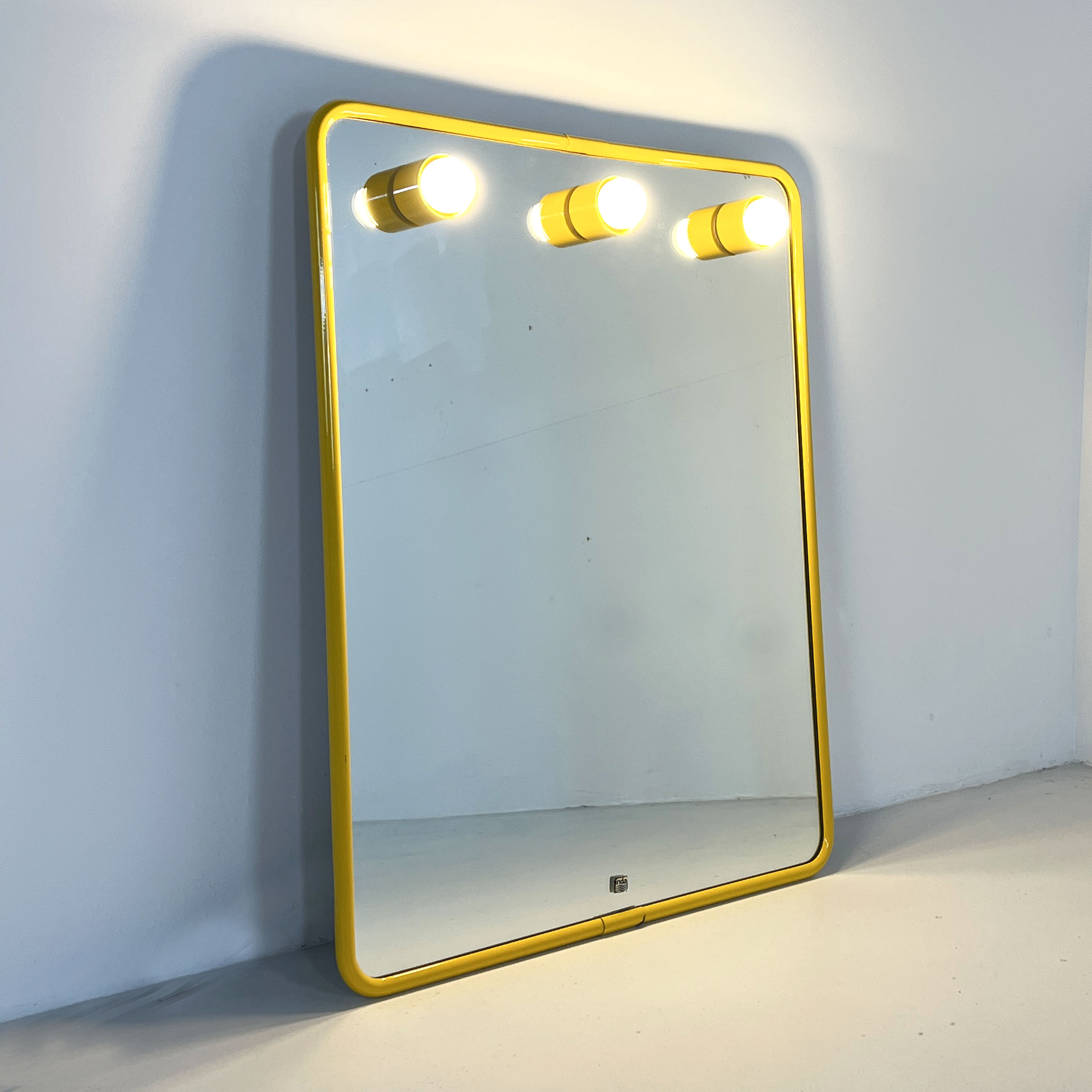 Mirror with integrated yellow metal bulbs, 1970