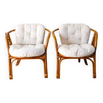 Pair of rattan and bamboo shell armchairs with linen cushions, 1960