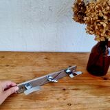 Vintage chrome wall coat rack with three hooks.