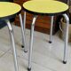 Pair of yellow Formica stools