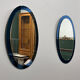 Rare pair of Italian blue oval mirrors, attributed to Cristal Arte, 1970s