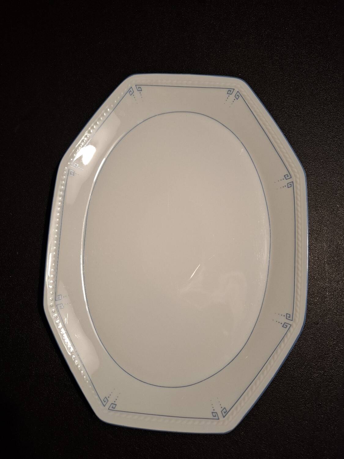 Dishes and porcelain sauceboat