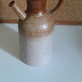 Vintage kid jug in two-tone sandstone with a handle and spout