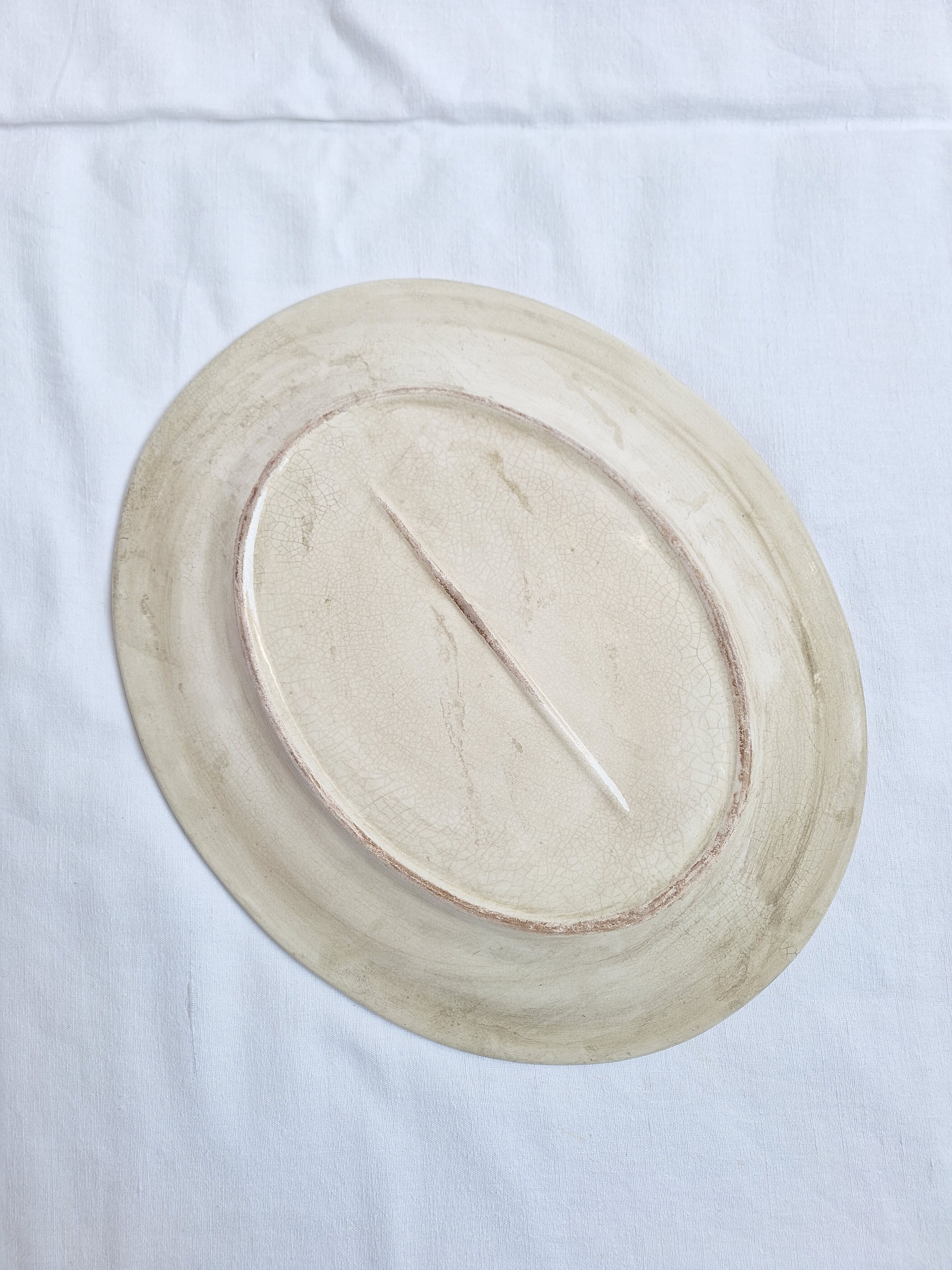 Oval plate, hand-painted meat platter in orange and green.
