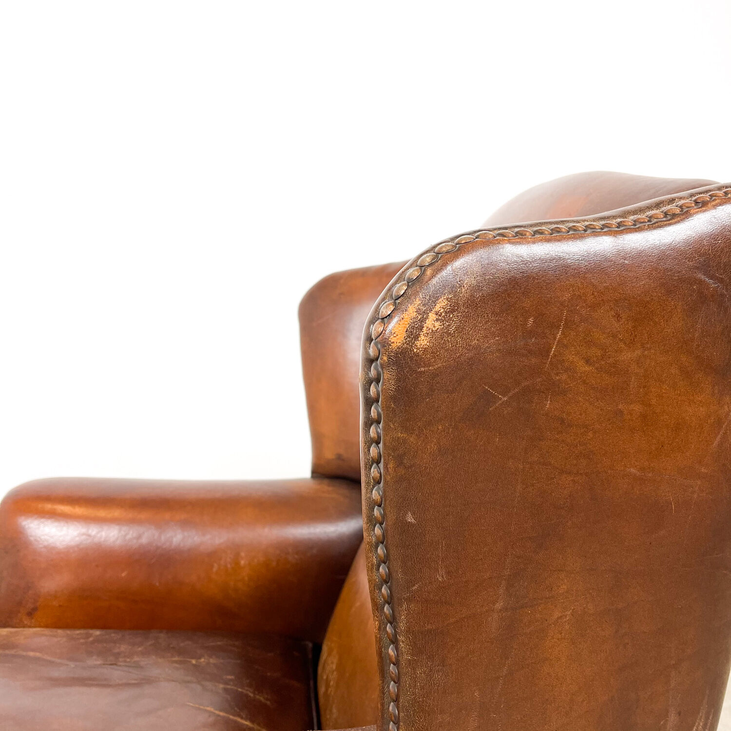Dark brown sheep leather wingback armchair vintage