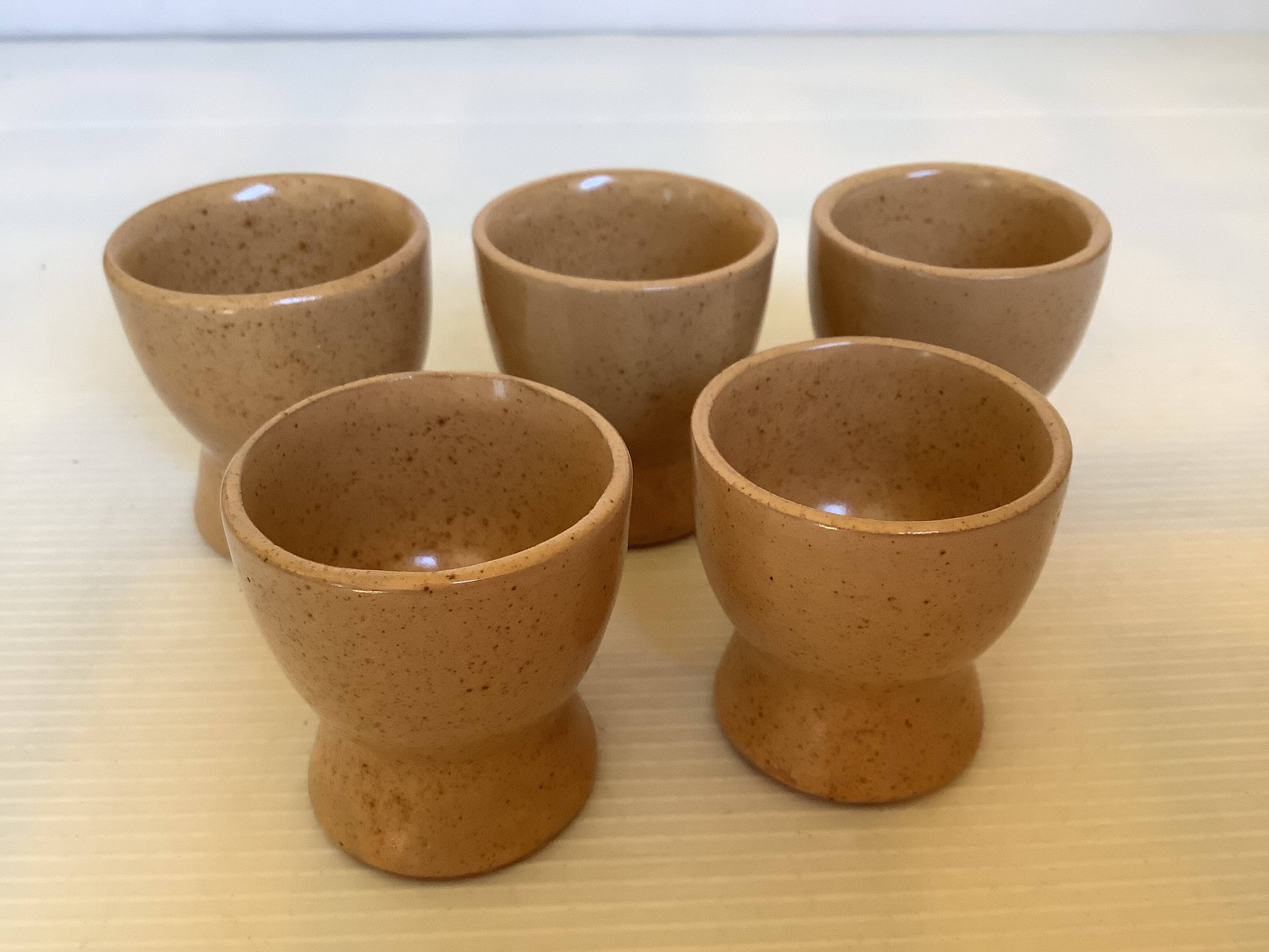 Five handmade stoneware egg cups