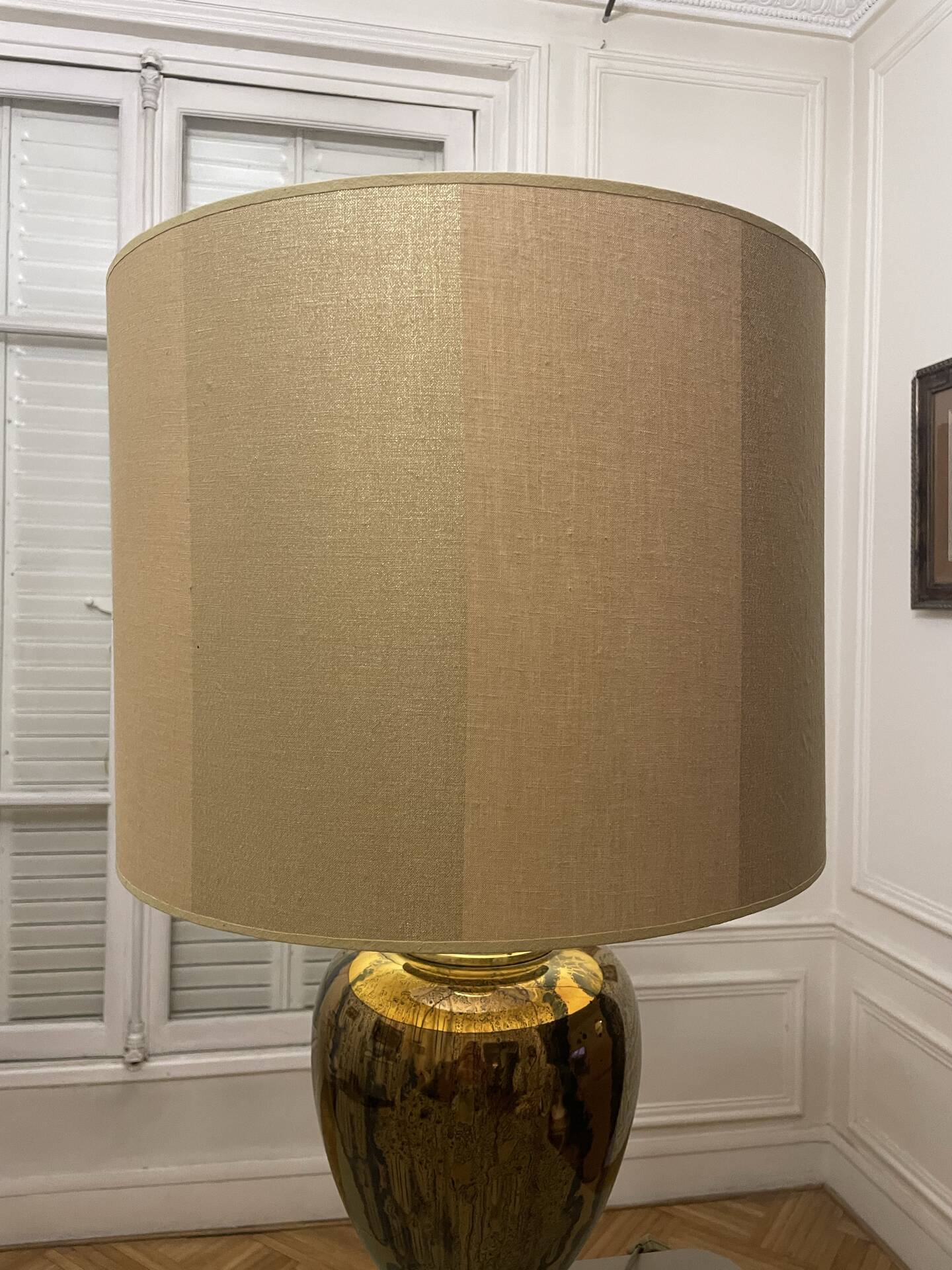 Bronze table lamp with a golden shade.