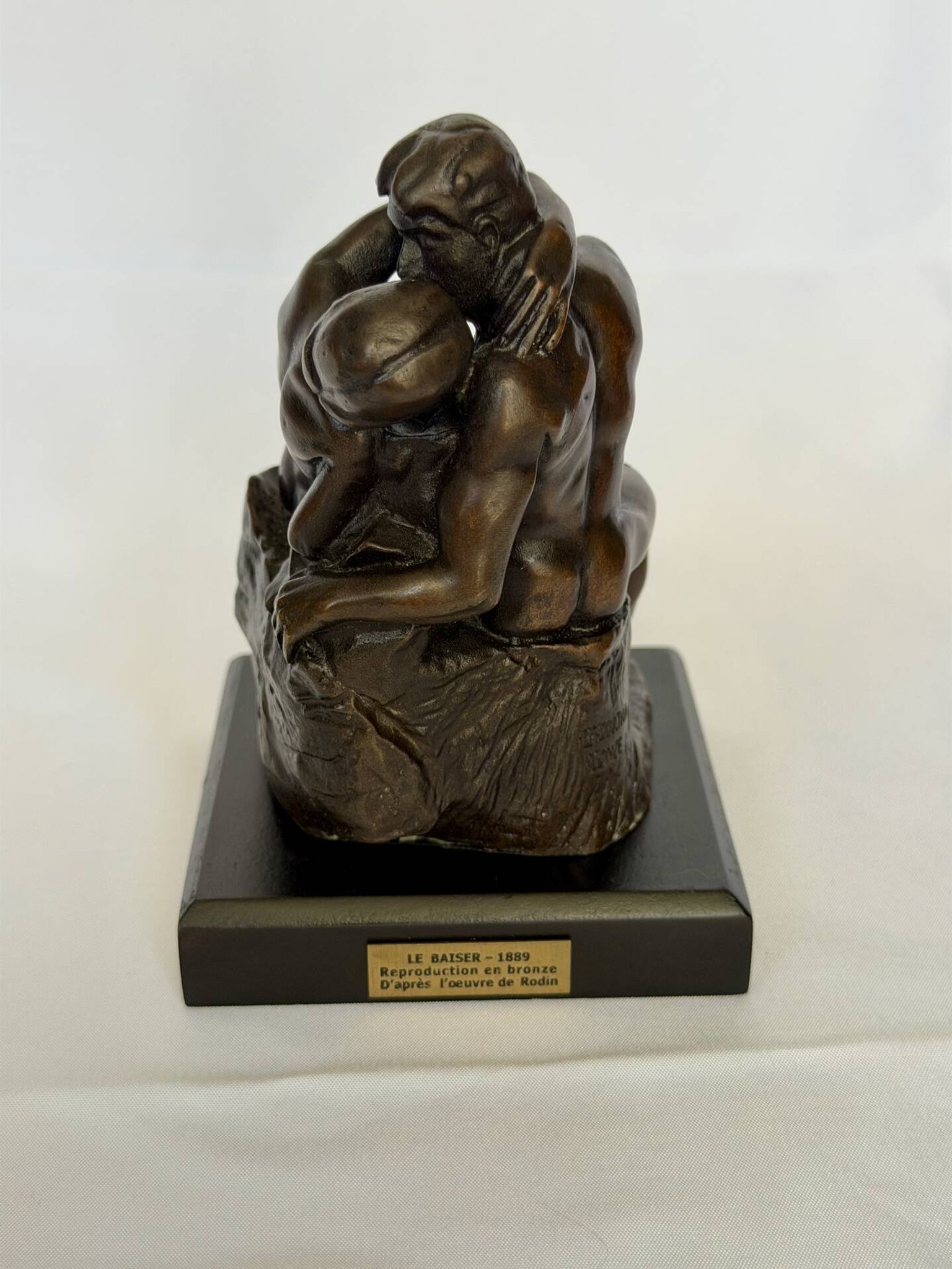 The bronze sculpture The Kiss, a reproduction of Rodin's statue, French sculpture.