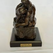 The bronze sculpture The Kiss, a reproduction of Rodin's statue, French sculpture.