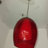 Pair of conical pendant lights in red tinted glass