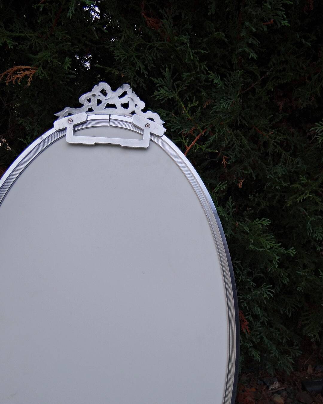 Oval mirror 66x37 Louis XVI style knot in vintage silver metal from the 70s