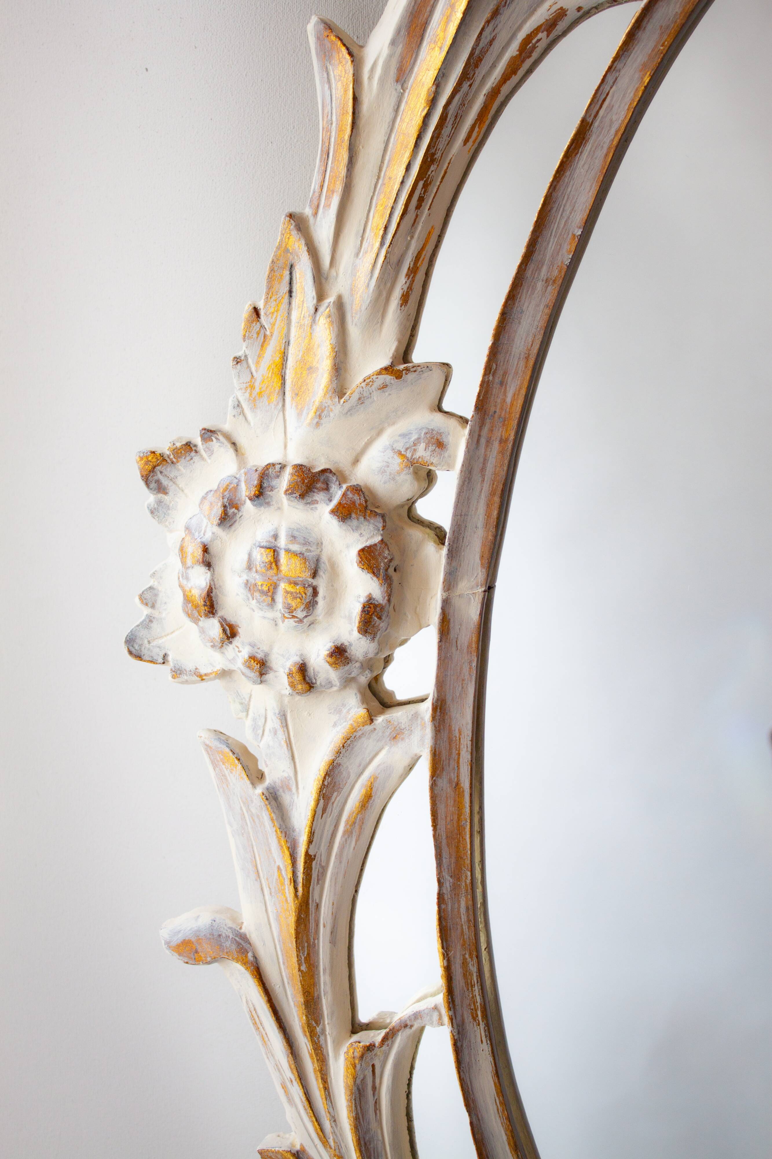 Antique oval mirror carved in wood.