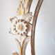 Antique oval mirror carved in wood.