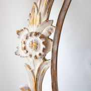 Antique oval mirror carved in wood.