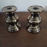 Two bronze-colored candlesticks