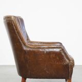 Grained cowhide armchair with a timeless design