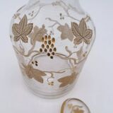 Old crystal carafe with golden decoration