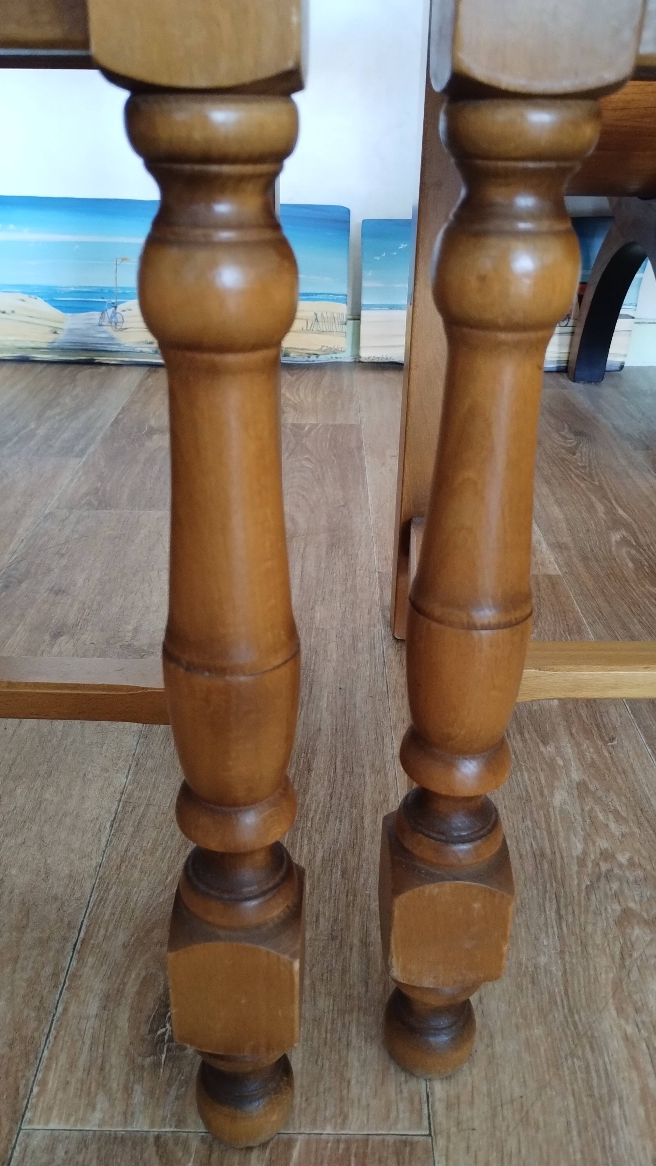 4 straw-seated solid wood chairs with high backs in rustic style.