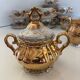 Gold Italian porcelain service. Coffee cups - sugar - cream pot / Gallant scene