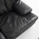 Black leather two-seater sofa. Roche Bobois edition. France, 1980s.