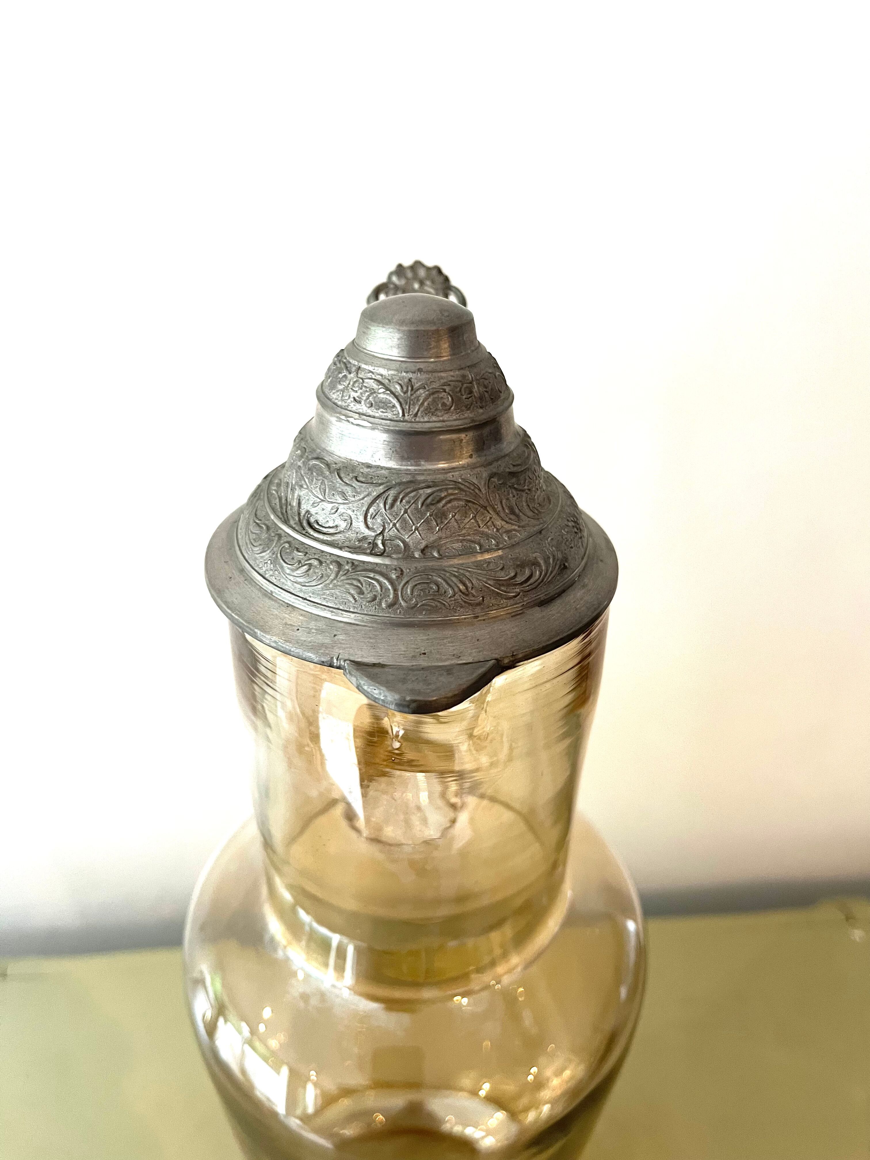 Vintage glass and tin jug