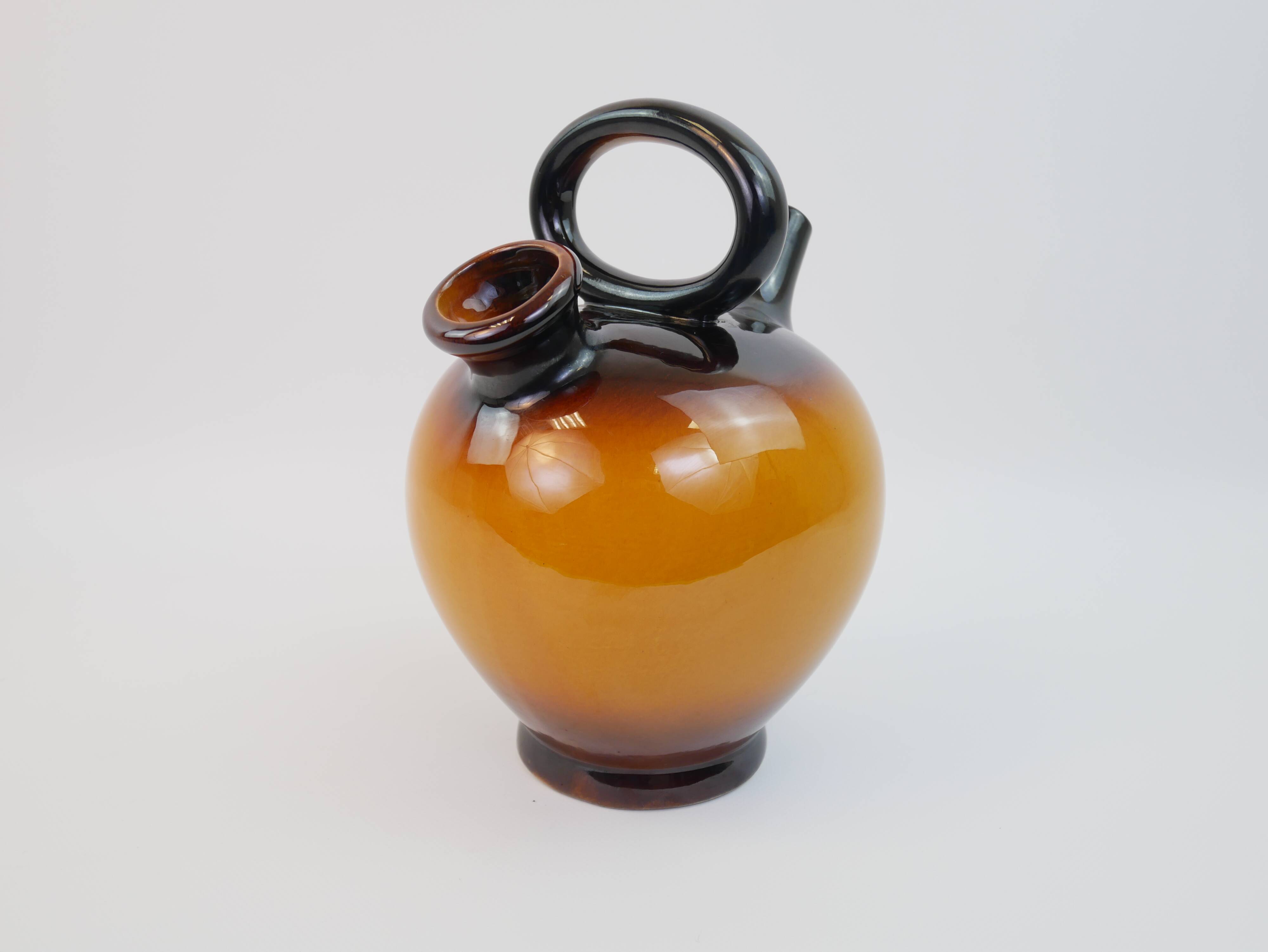 Ochre-orange ceramic jug signed under the base CP Claude Paci