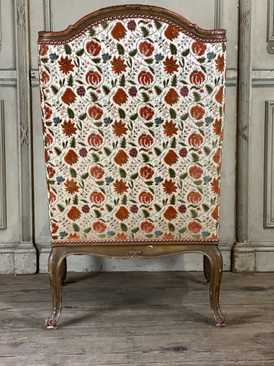 Regency style armchair in gilded wood