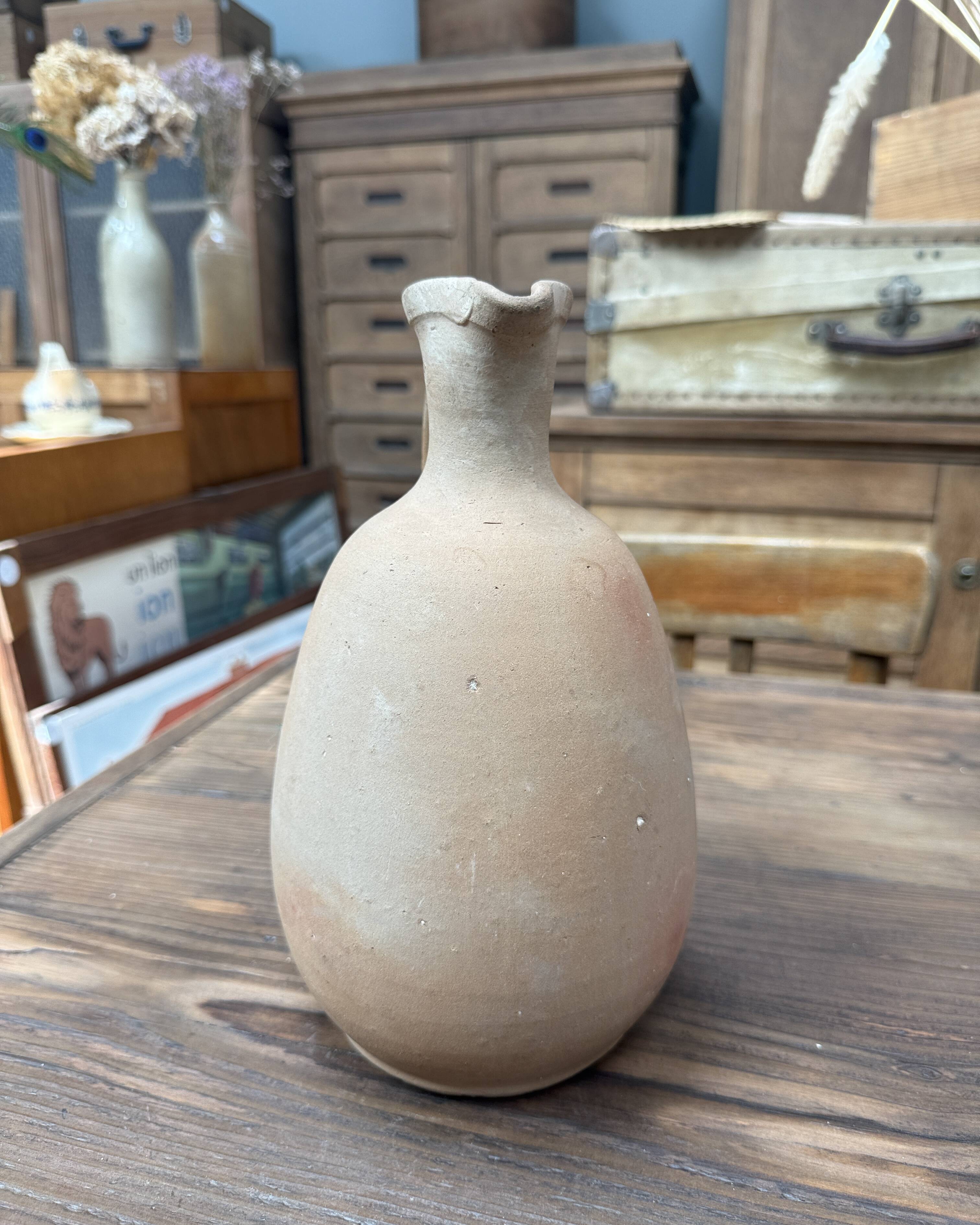 Unfired clay pitcher