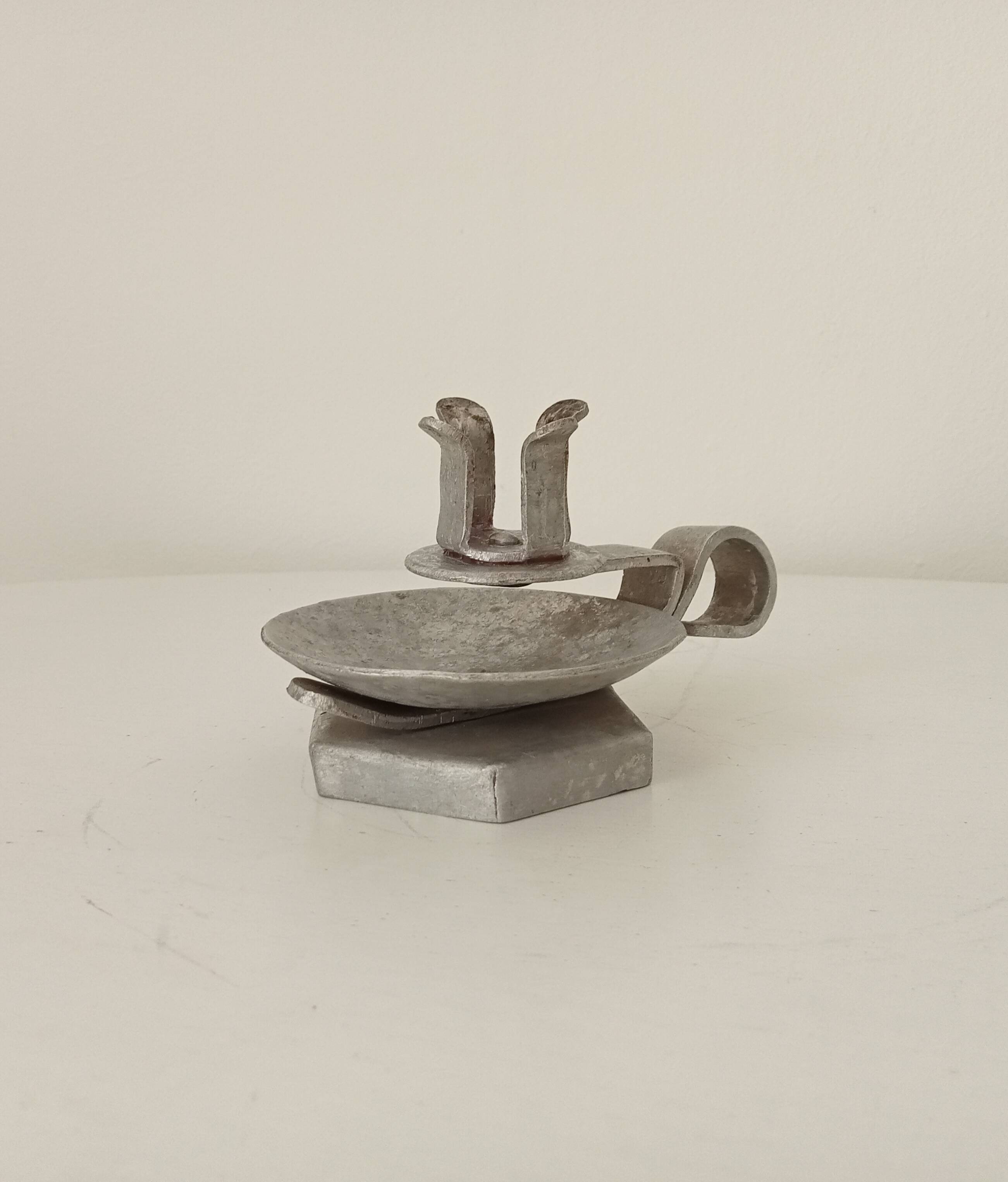 Vintage zinc hand candle holder