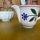 Old porcelain milk jug with barbel decoration