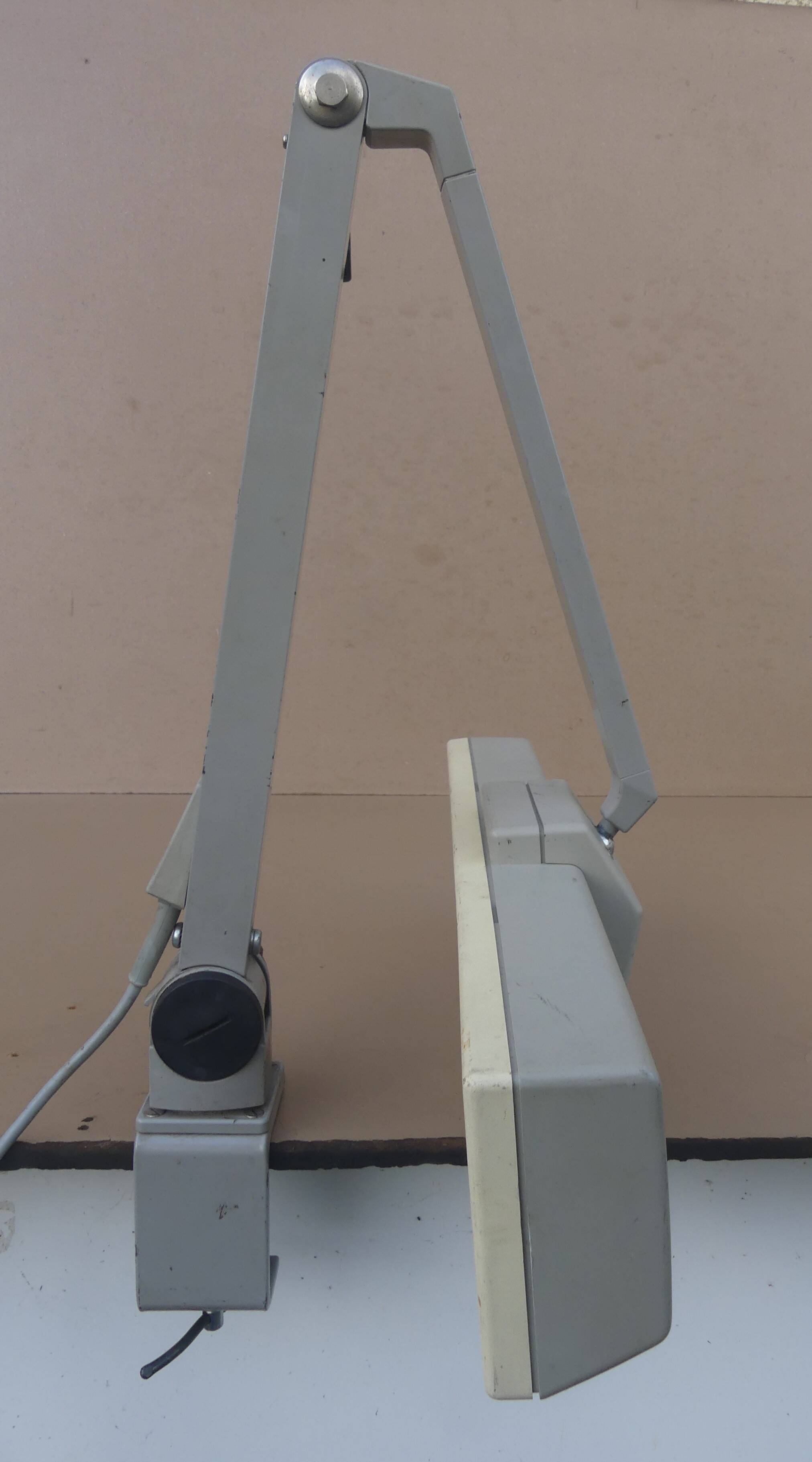 WALDMANN articulated workshop lamp with two industrial clamp arms for architects.
