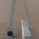 WALDMANN articulated workshop lamp with two industrial clamp arms for architects.