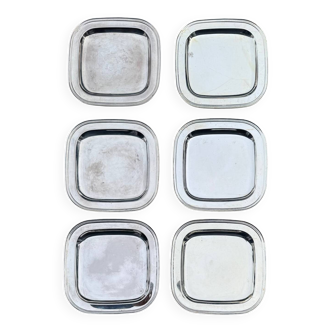 Silver-plated metal underplates from the 1980s.