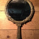 Antique mirror facing round hand in bronze 23cm