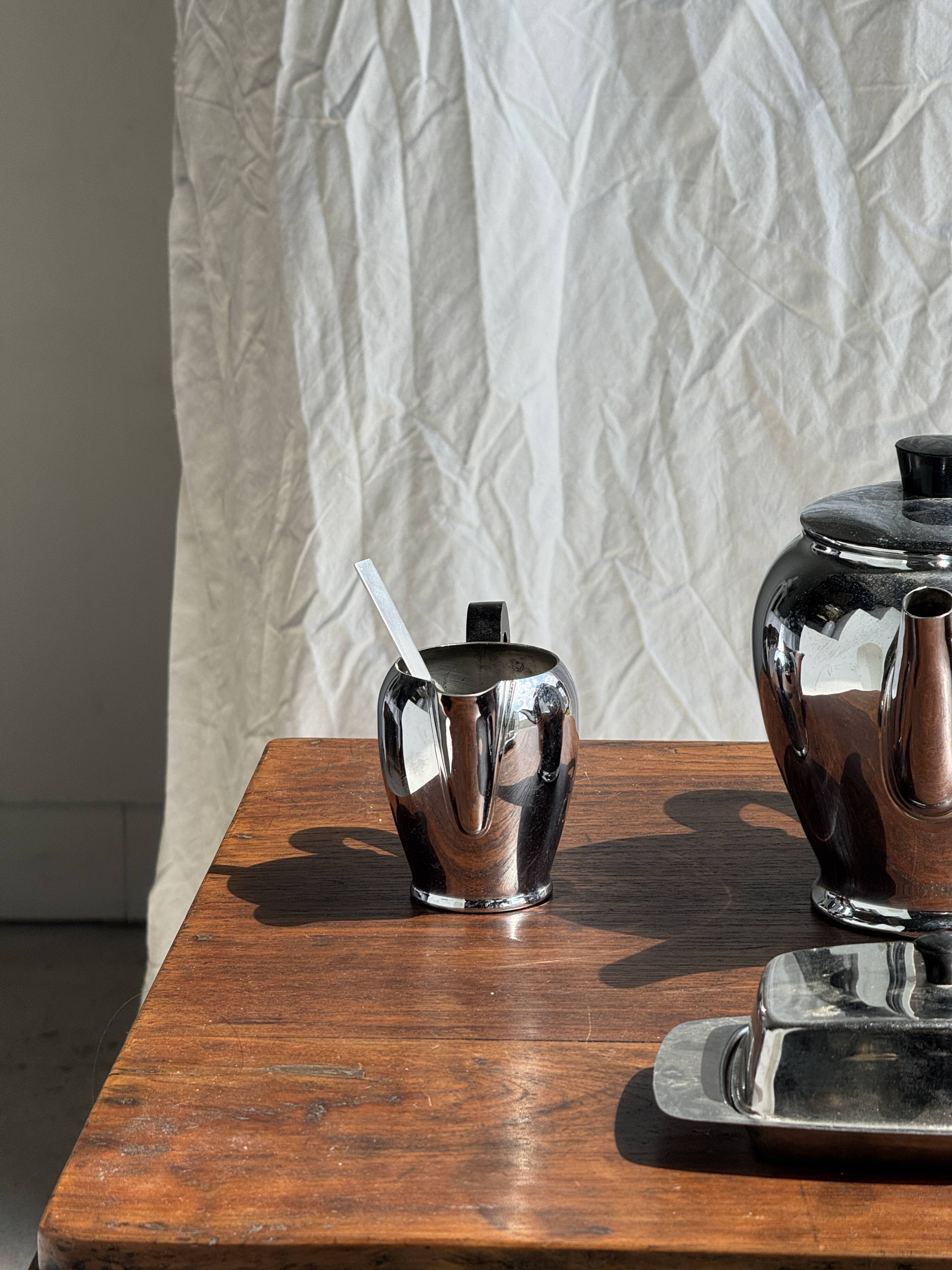Tea set including teapot, milk jug, sugar bowl and butter dish
