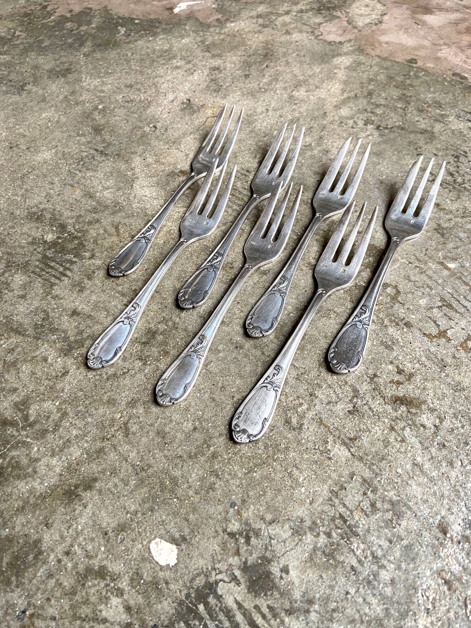 7 silver metal dessert forks
