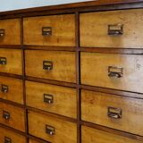 School cabinet bank of vintage Dutch drawers in mid-twentieth century pine