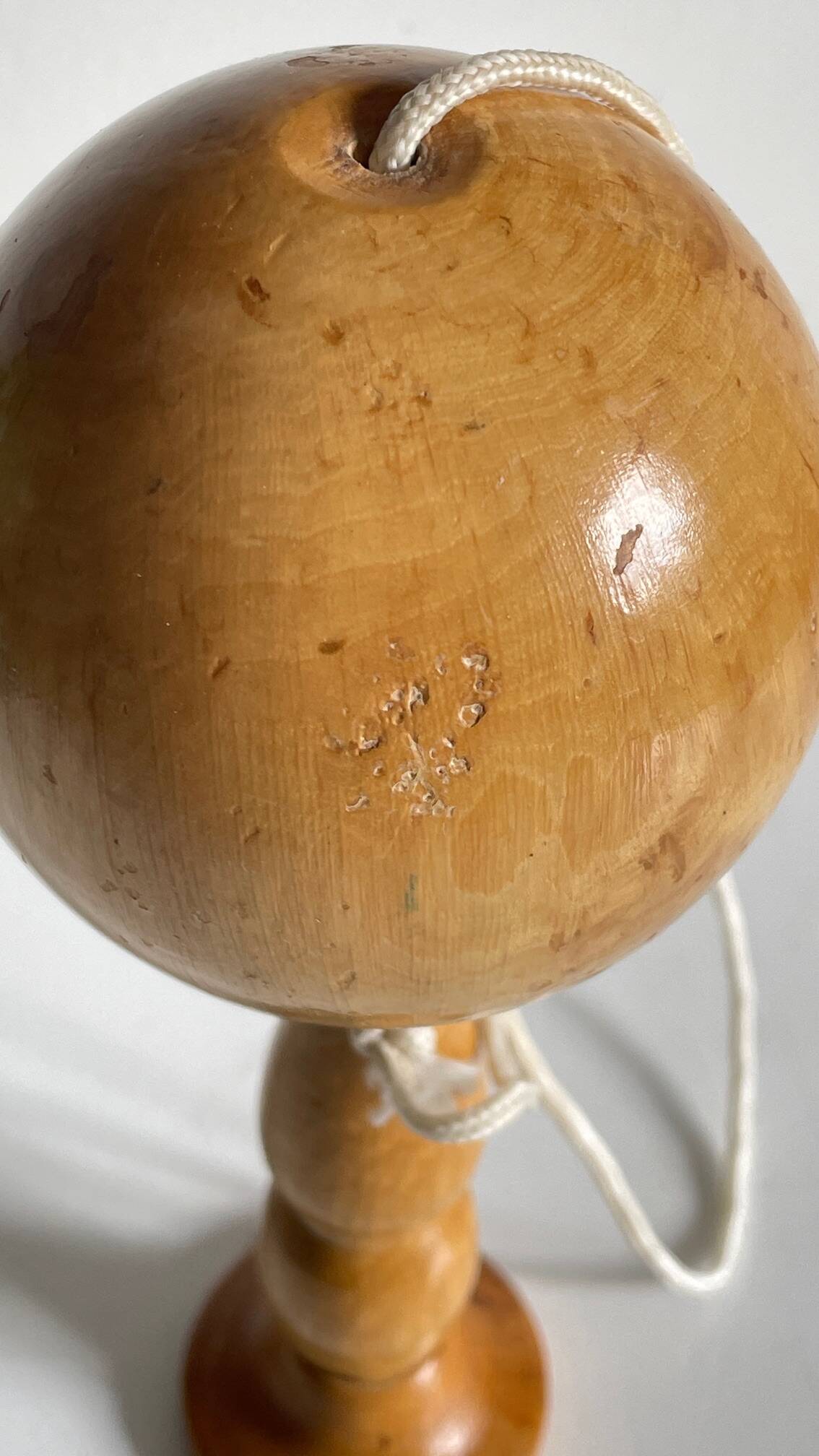 Vintage wooden cup-and-ball toy