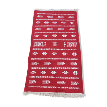 Handmade red and white carpet