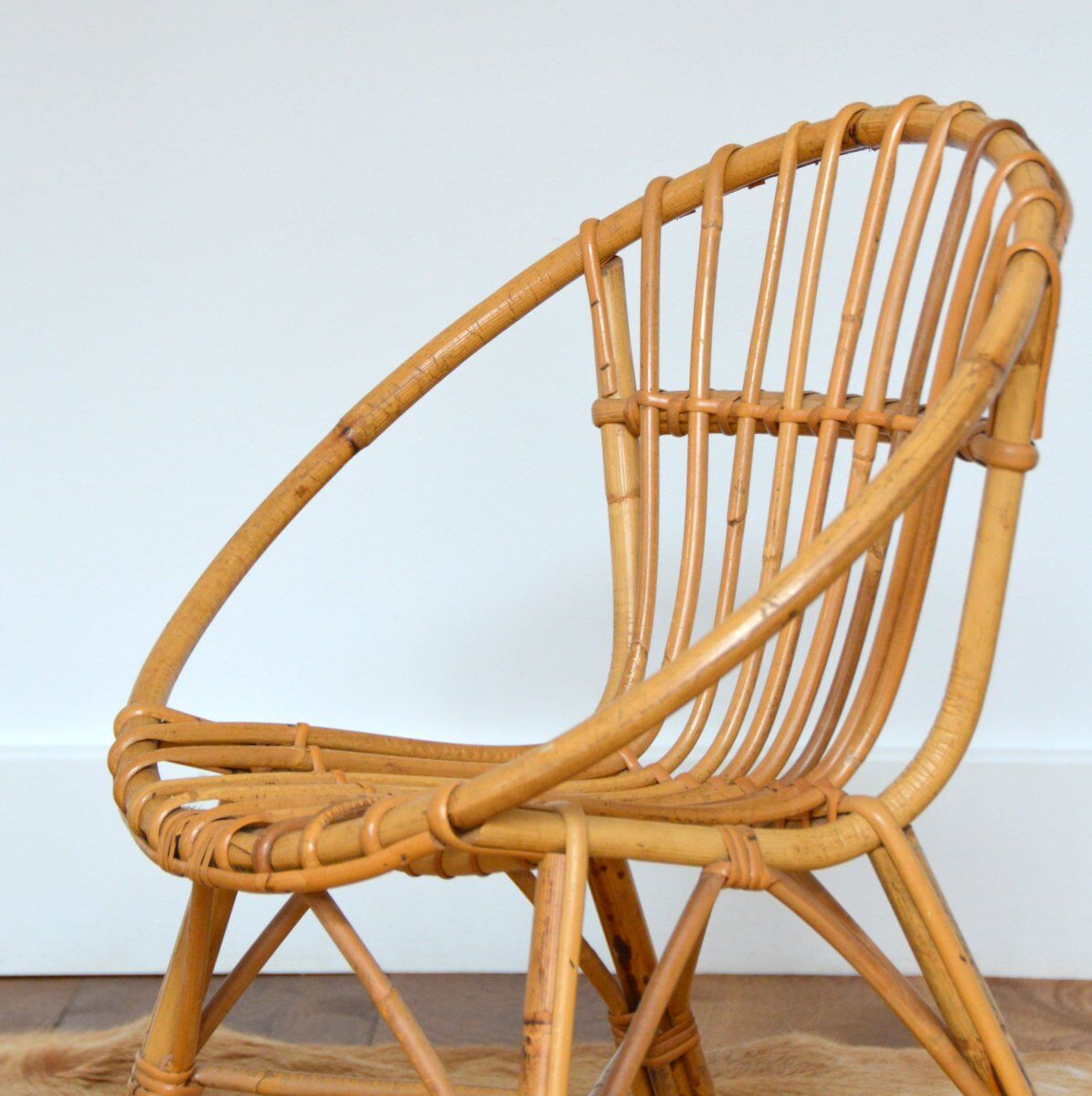 Children's shell armchair in rattan 1960s