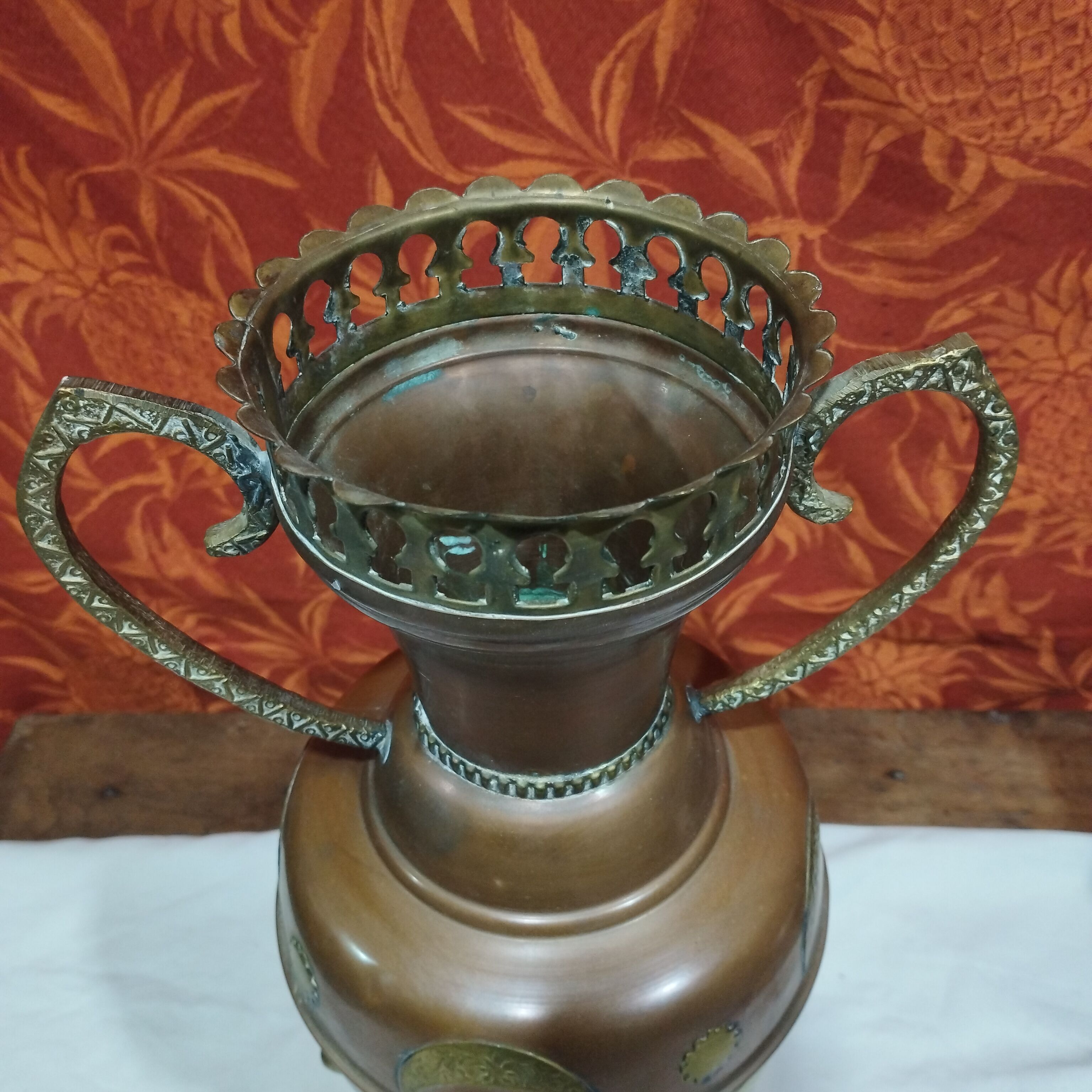Oriental style vase or copper amphora and brass decoration
