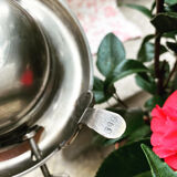 Antique silver sweetener with rolling lid