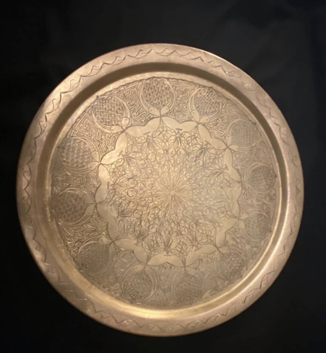 Old oriental tray in yellow copper