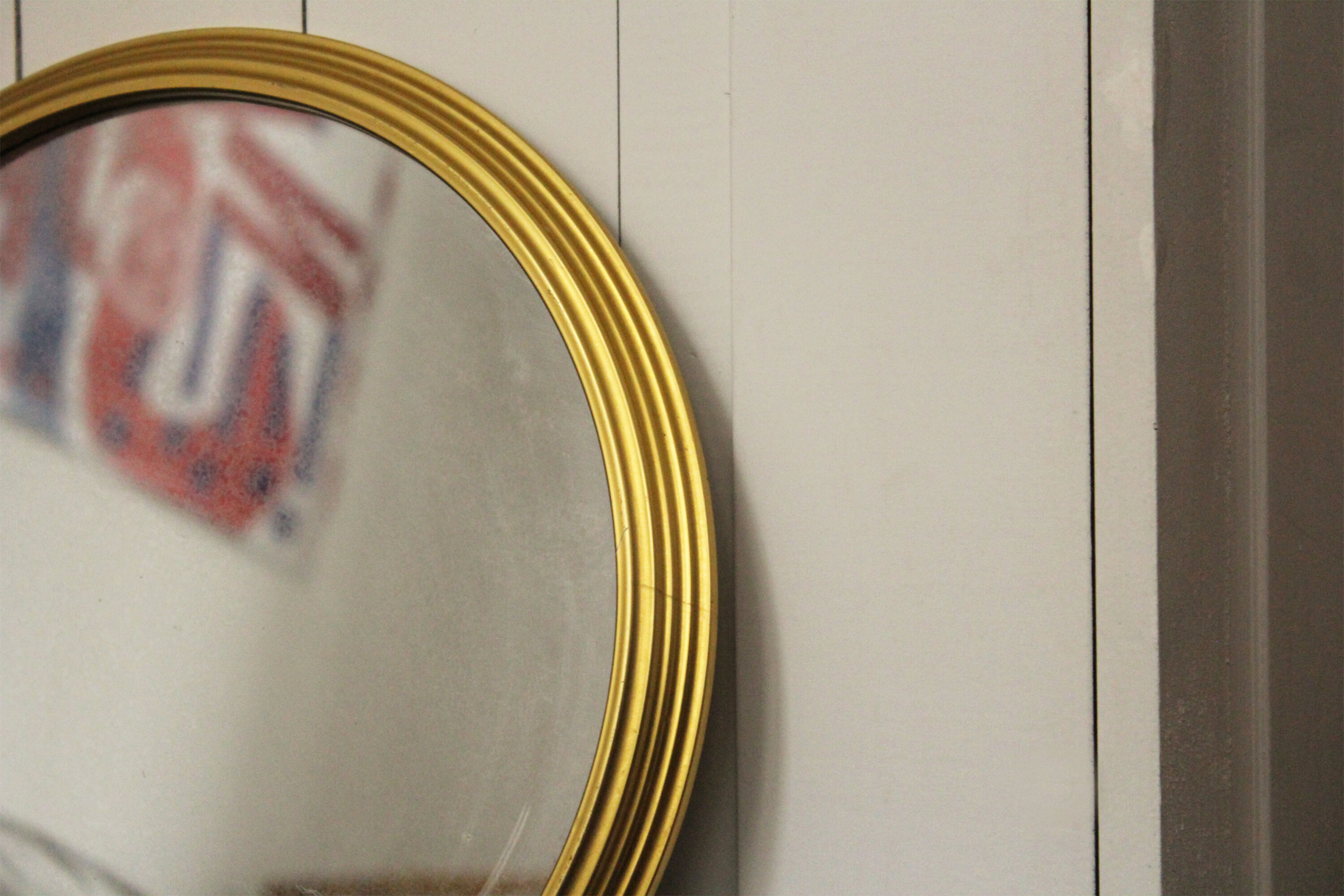 Miroir vintage rond  bordure acier doré